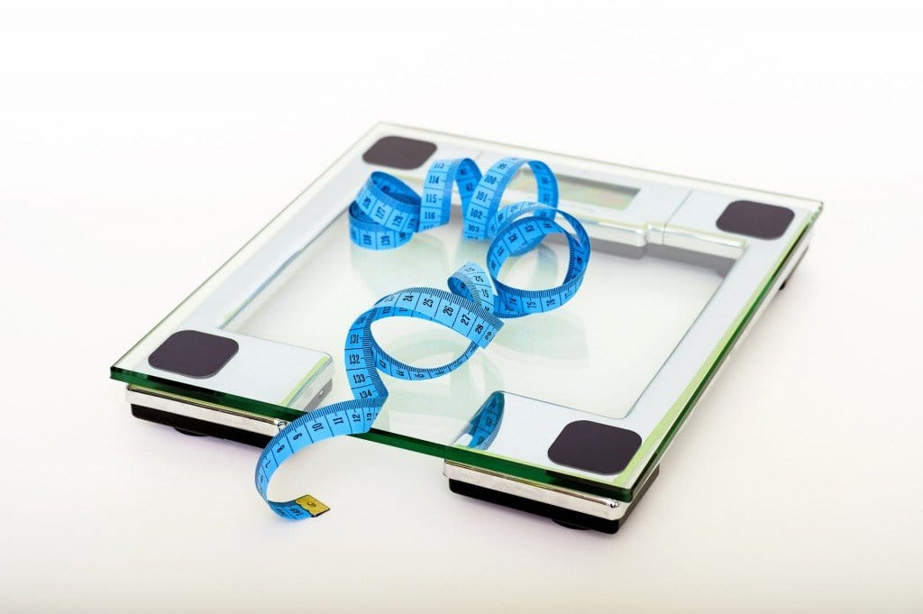 Blue measuring tape on a scale