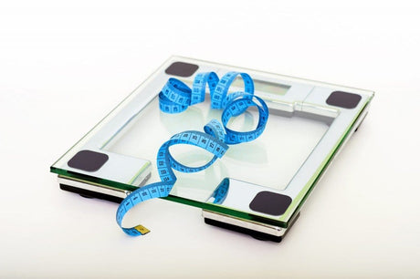 Blue measuring tape on a scale