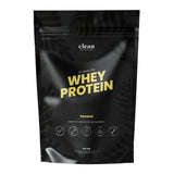 Black whey protein package flavoured banana, with yellow text on a white background