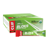 Box of Clif Bloks energy chews with a single packet on a white background