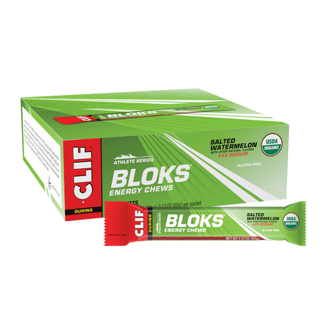 Box of Clif Bloks energy chews with a single packet on a white background