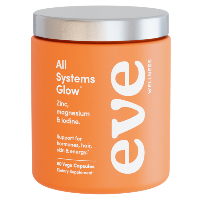 Orange supplement jar with silver lid labeled 'All Systems Glow' by Eve Wellness on a white background
